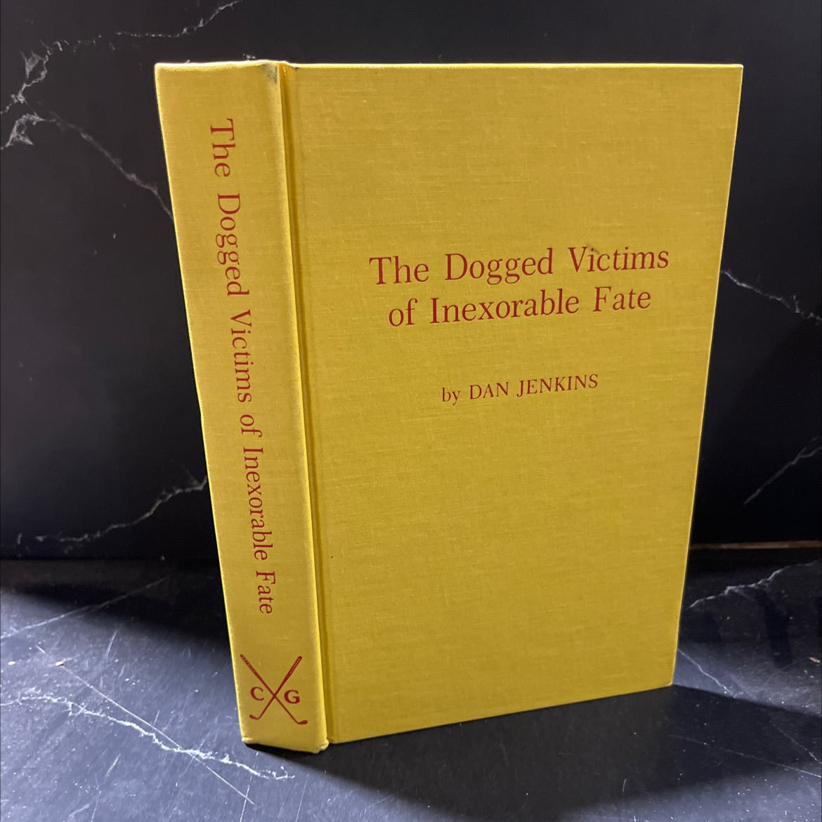 the dogged victims of inexorable fate book, by Dan Jenkins, 1985 Hardcover image 1