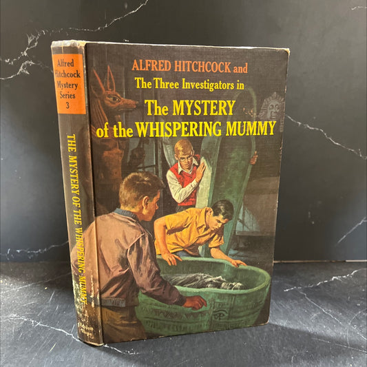 alfred hitchcock and the three investigators in the mystery of the whispering mummy book, by robert arthur, 1965 image 1