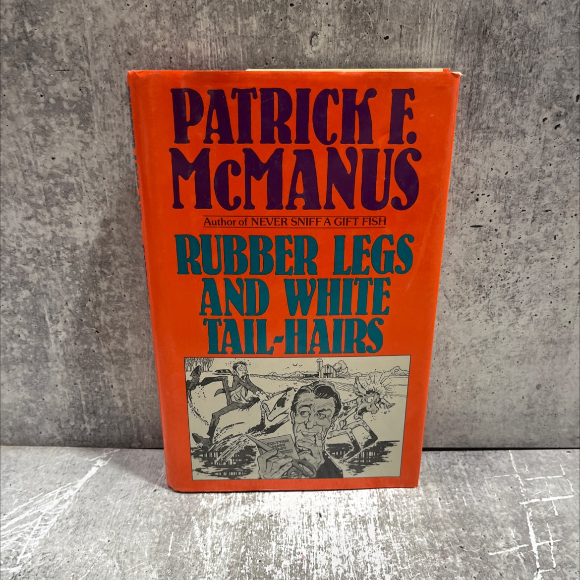 rubber legs and white tail-hairs book, by Patrick F. McManus, 1987 Hardcover image 1