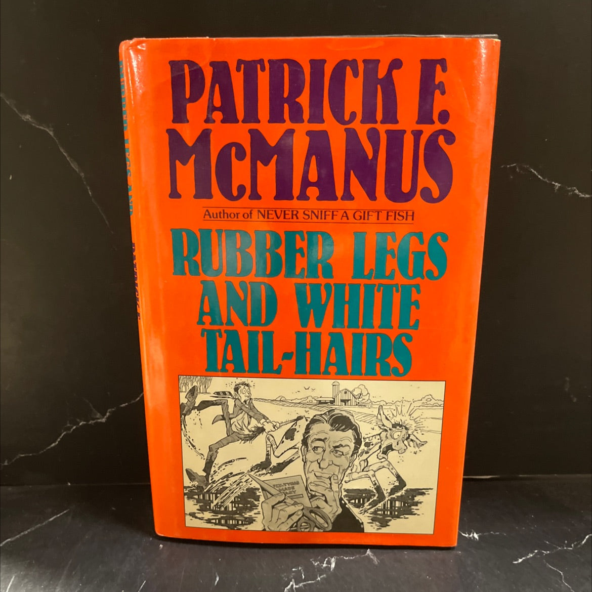 rubber legs and white tail-hairs book, by Patrick F. McManus, 1987 Hardcover image 1