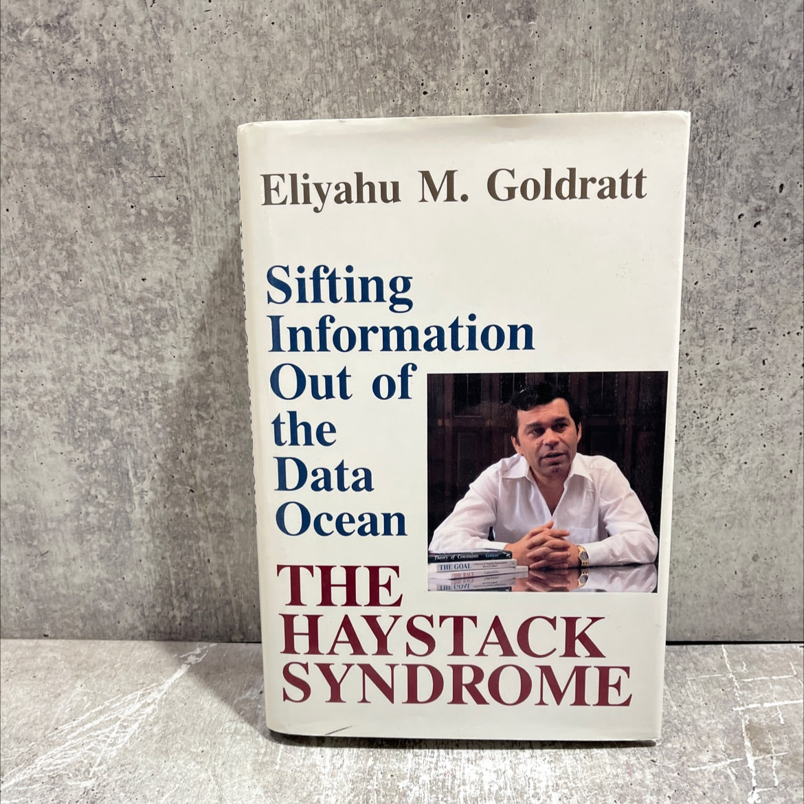 the haystack syndrome: sifting information out of the data ocean book, by eliyahu m. goldratt, 1990 Hardcover image 1